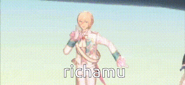 a man is standing on a stage with his hands on his face and the words richamu written on the bottom of the screen .