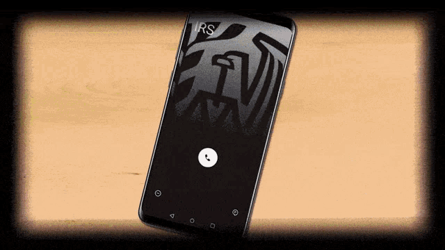 a cell phone with rs written on the screen