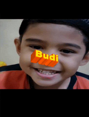 a young boy with the word budi on his face