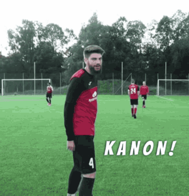 a man in a red and black jersey with the number 4 on it