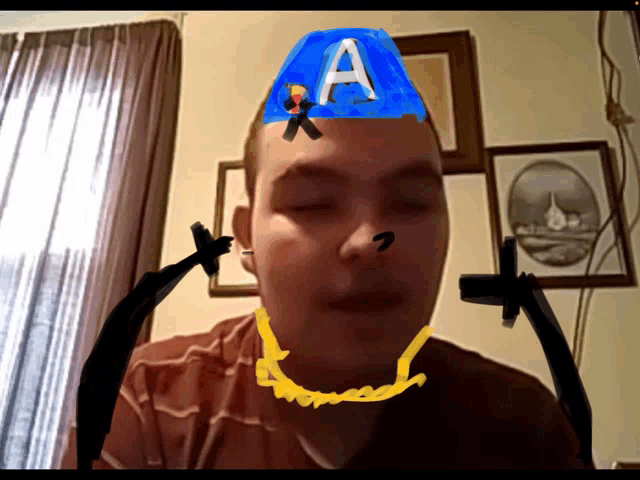 a man with the letter a on his hat