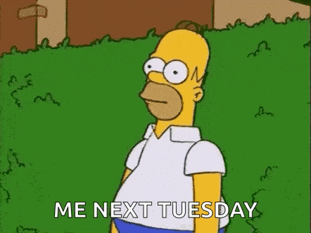 homer simpson from the simpsons is standing in a grassy field and says `` me next tuesday '' .