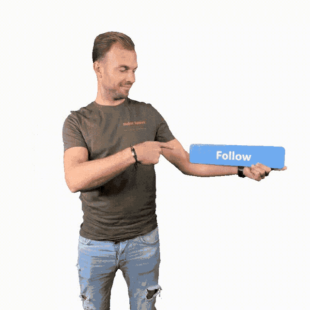 a man in a green shirt is holding a blue sign that says follow