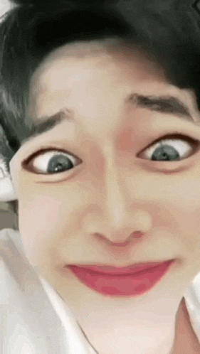 a close up of a person 's face with a funny face .