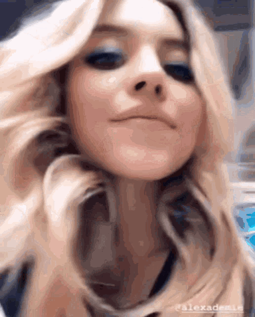 a close up of a woman 's face with the name alexademie visible
