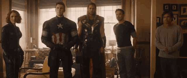 a group of avengers standing in a living room including captain america
