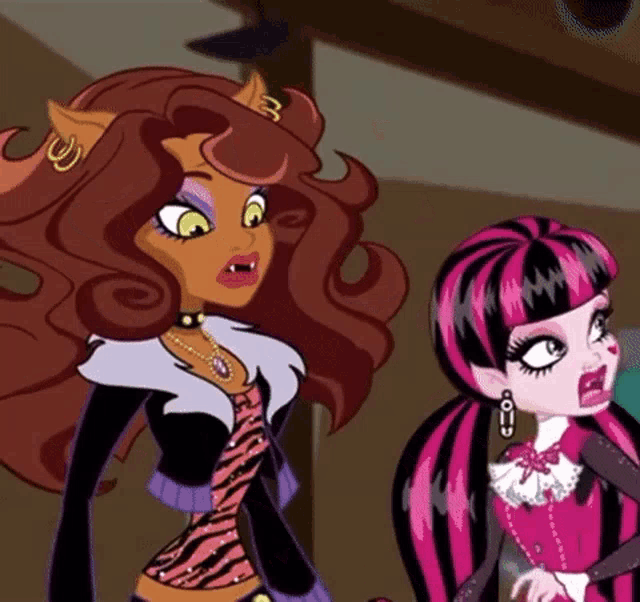 clawdeen wolf and draculaura monster high dolls are standing next to each other
