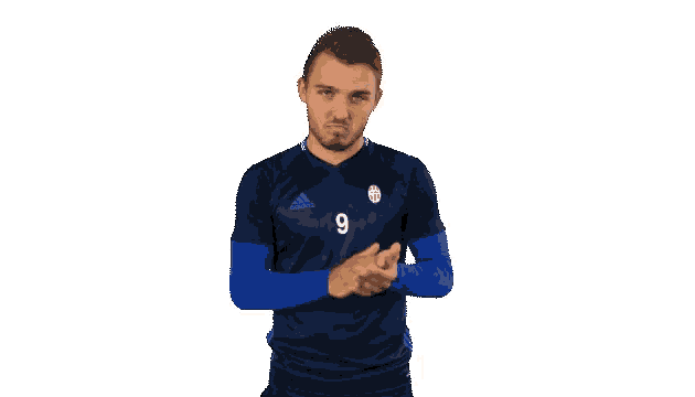 a man wearing a jersey with the number 9 on it is clapping his hands