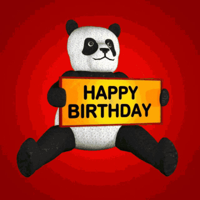 a stuffed panda bear holding a sign that says happy birthday