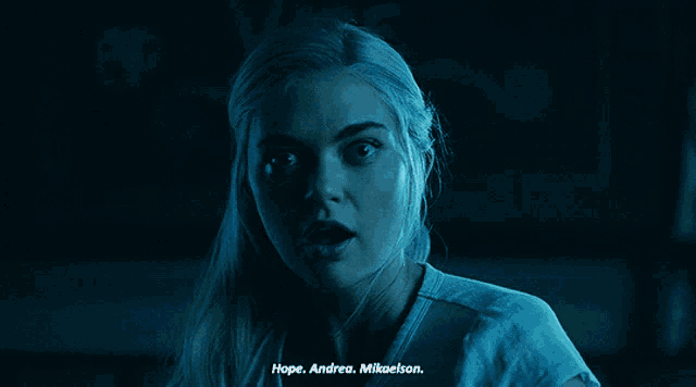 a close up of a woman 's face with the words hope andrea mikaelson below her