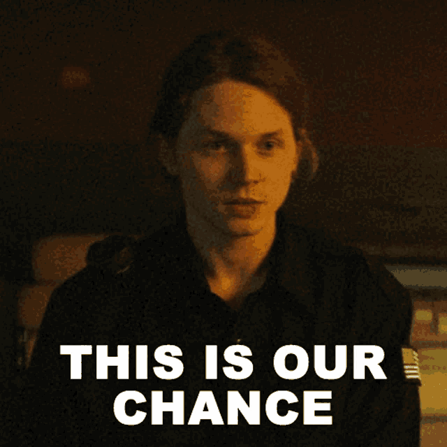 a man in a black shirt with the words this is our chance above him