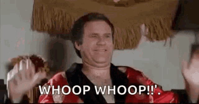 a man in a robe is waving his hands in the air and saying `` whoop whoop ! ''
