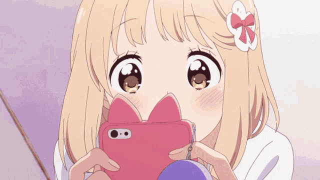 a girl with a flower in her hair is holding a pink phone