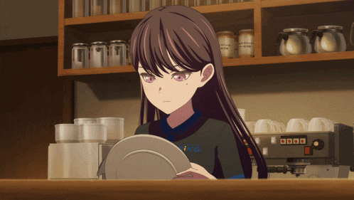 a girl in a uniform with the word ing on it holds a plate