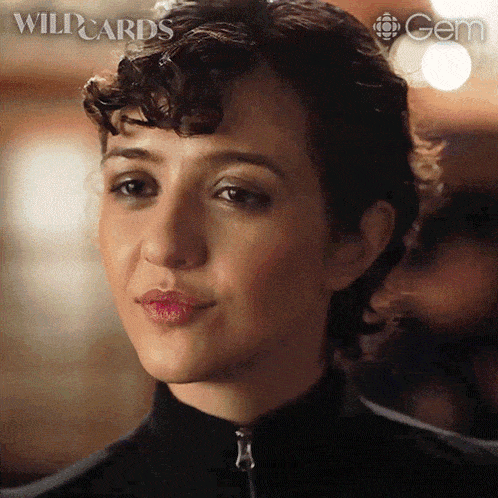 a close up of a woman 's face with the word wildcards written on the bottom