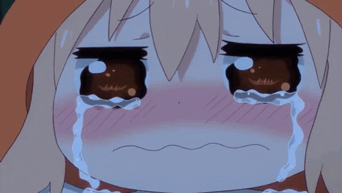 a close up of a girl crying with tears coming out of her eyes