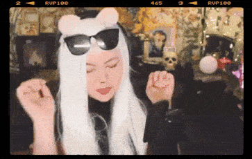 a video of a woman wearing sunglasses and a wig says rup100 on the bottom