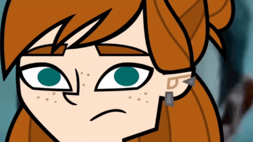 a close up of a cartoon character 's face with green eyes