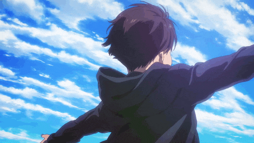a person with their arms outstretched looking up at the sky