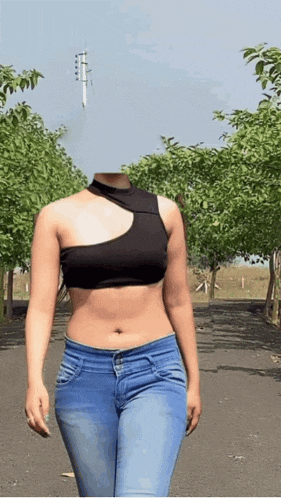 a woman without a head is walking down a road .