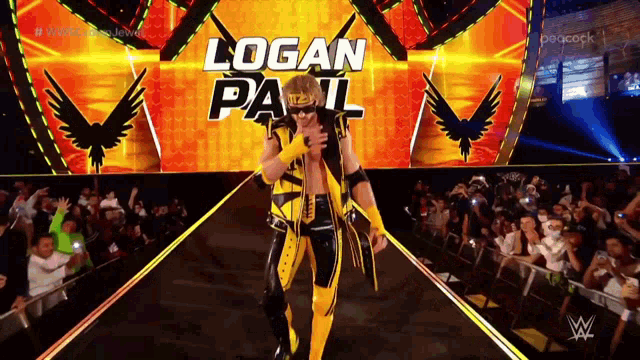 a wrestler named logan pail is walking down a ramp