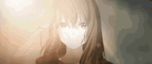 a close up of a girl 's face with the sun shining through her eyes .