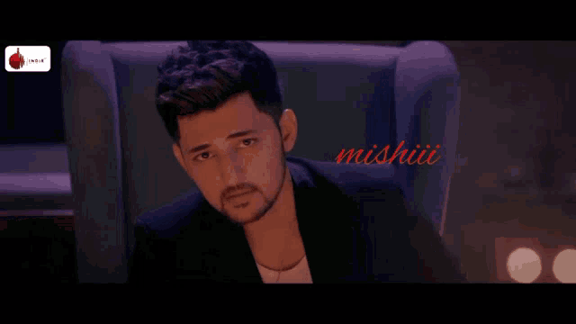 a man is sitting in a chair with the words dard hony dou written in red