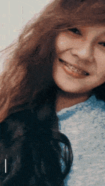 a girl with braces on her teeth is smiling