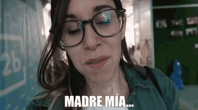 a woman wearing glasses says madre mia in spanish
