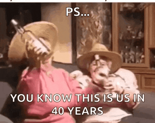 a man and a woman are sitting on a couch drinking wine and talking on a cell phone .