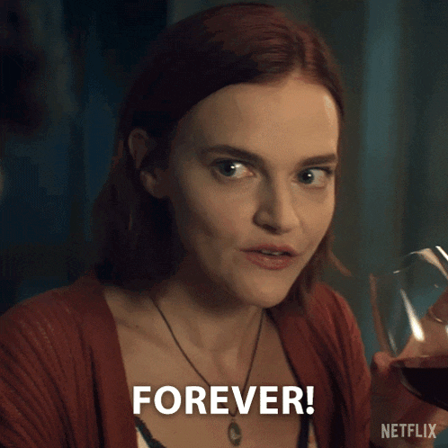 a woman holds a glass of wine and says " forever "