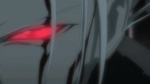 a close up of a person 's eye with a red glow