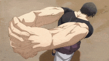 a man with huge arms is holding another man 's arm