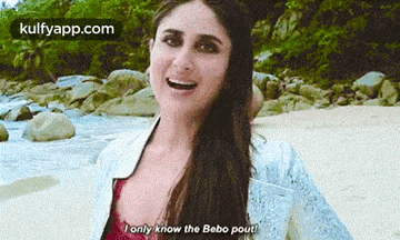 a woman is standing on a beach with a river in the background and says `` i only know the bebo pout '' .