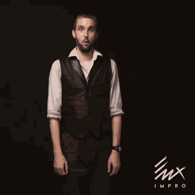 a man wearing a vest and a white shirt stands in front of a black background that says imx improv
