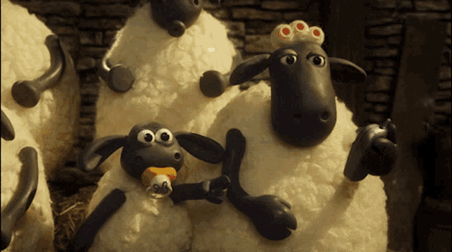 a cartoon sheep with a pacifier and a crown on its head