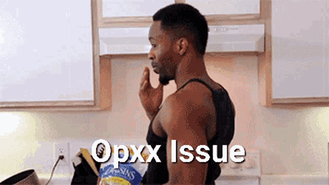 a man eating raisins in a kitchen with the word opxx issue written above him