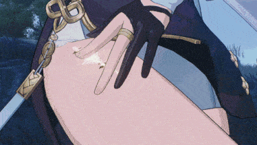 a close up of a person 's hand with a ring