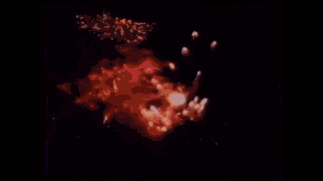 a blurry image of a person in a dark room