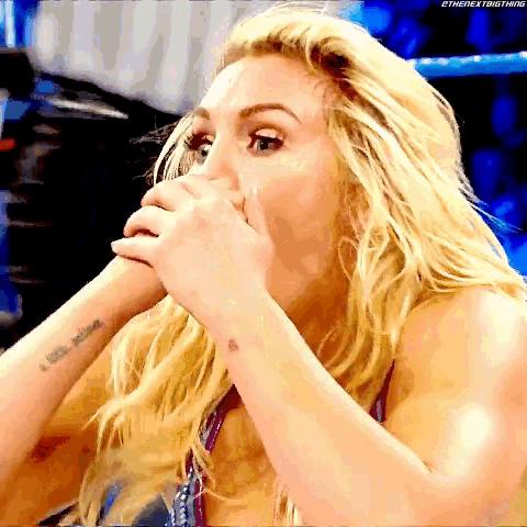 a woman with a tattoo on her wrist is covering her mouth