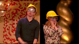 a man and a woman wearing hard hats and goggles standing next to each other