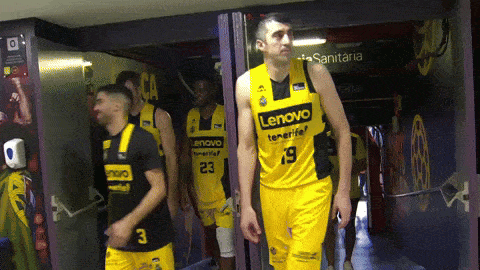 a group of basketball players wearing yellow jerseys with the word lenovo on them
