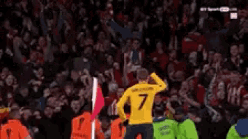a soccer player wearing a yellow jersey with the number 7