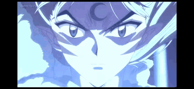 a close up of a person 's face with a crescent moon on their forehead
