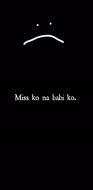 a black background with a sad face and the words `` miss ko na babi ko '' written on it .