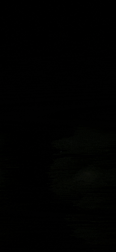 a black background with a few white spots on it .