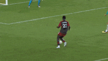 a soccer game is being played on a field with a continental advertisement in the background