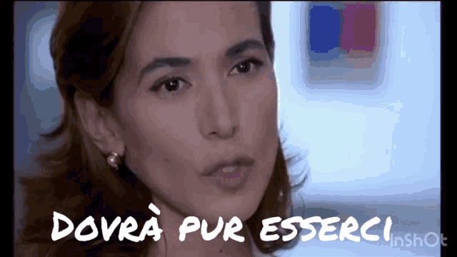 a close up of a woman 's face with the words " dovra pur esserci " written above her