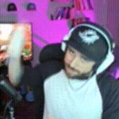 a man with a beard wearing headphones and a hat with the letter e on it