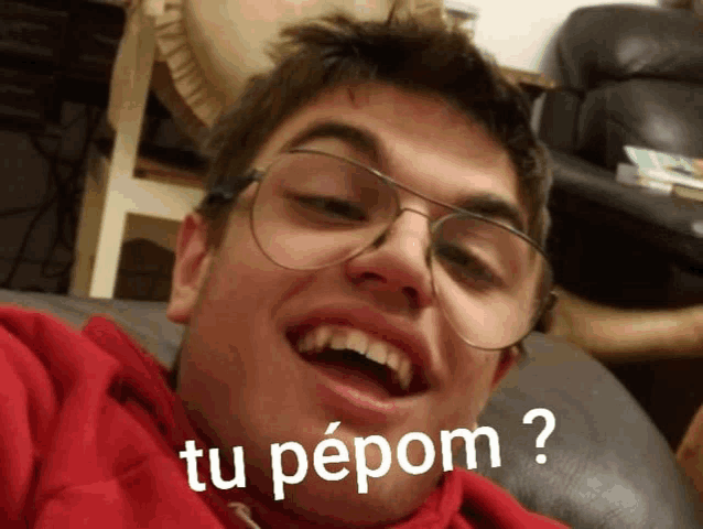 a young man wearing glasses is making a funny face with the words tu pepom written below him